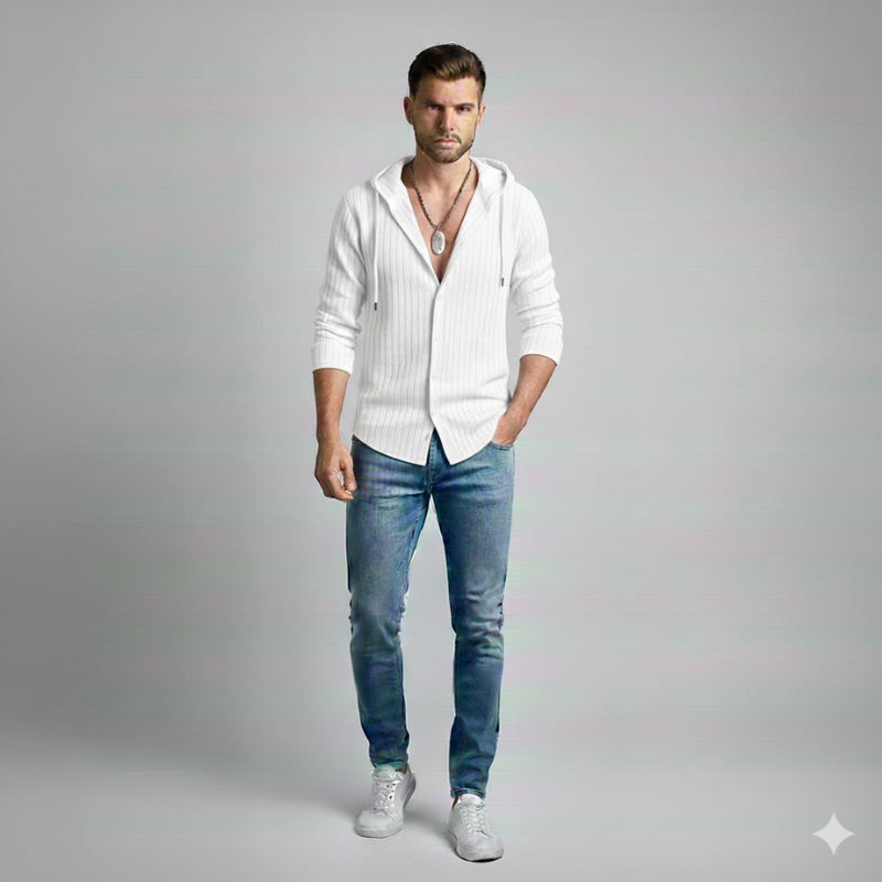 Man wearing a white hoodie over a shirt with blue jeans on a gray background
