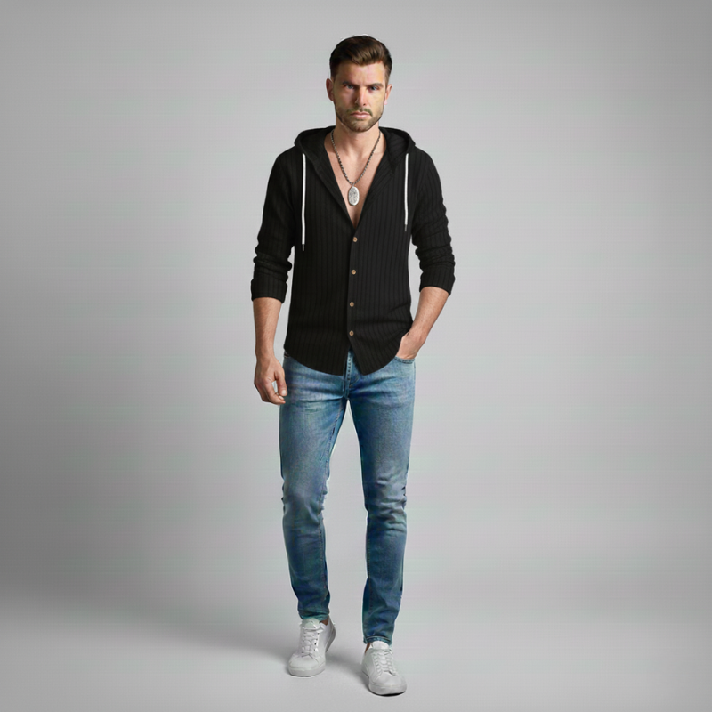 Man wearing a black hoodie, blue jeans, and white sneakers on a gray background