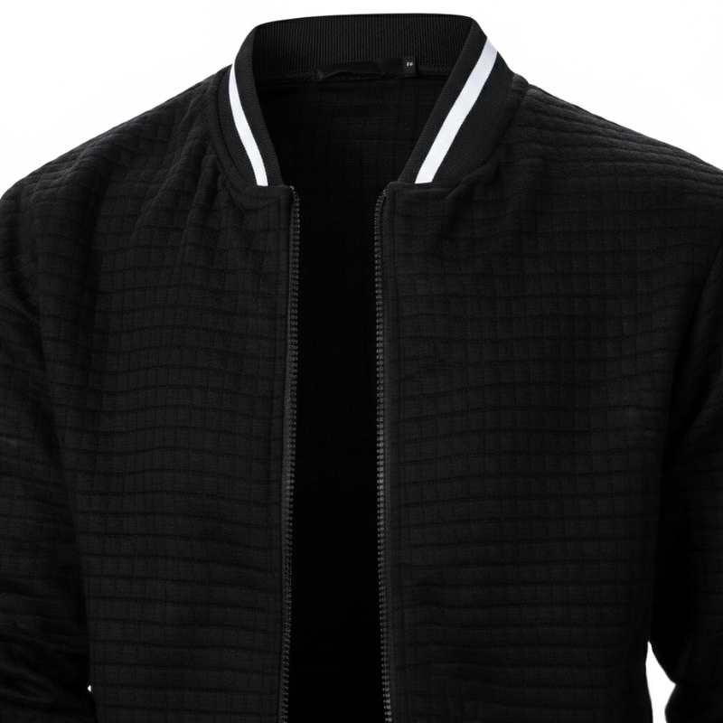 Black bomber jacket with white trim on a white background