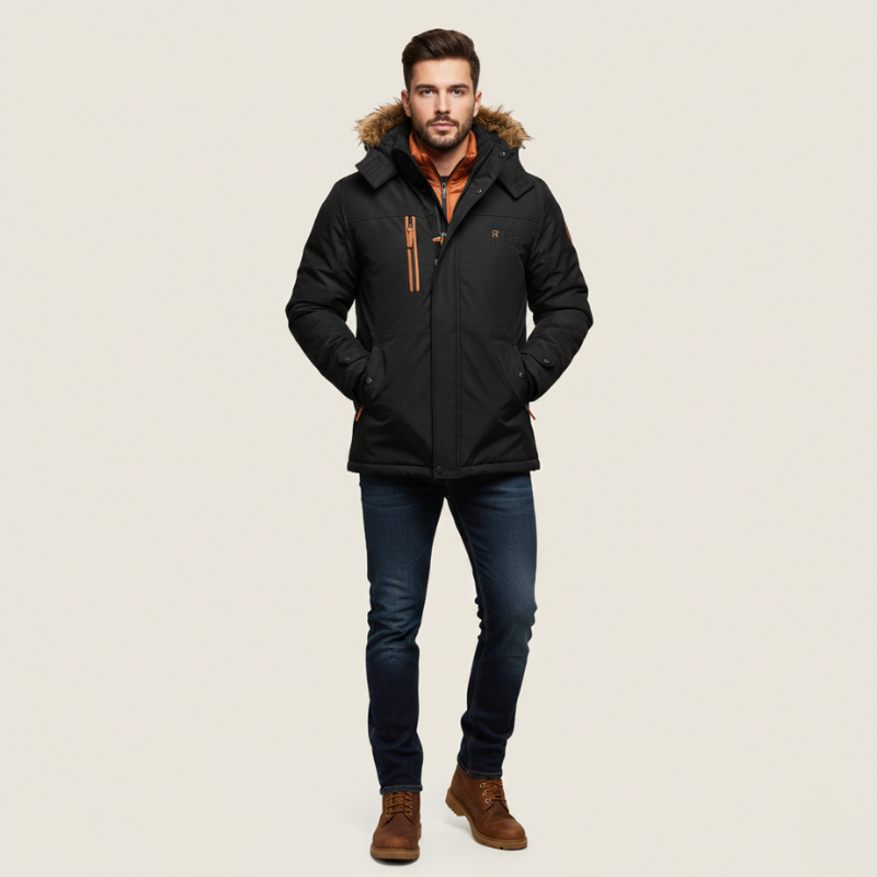 Man wearing a black winter coat with fur hood on a beige background