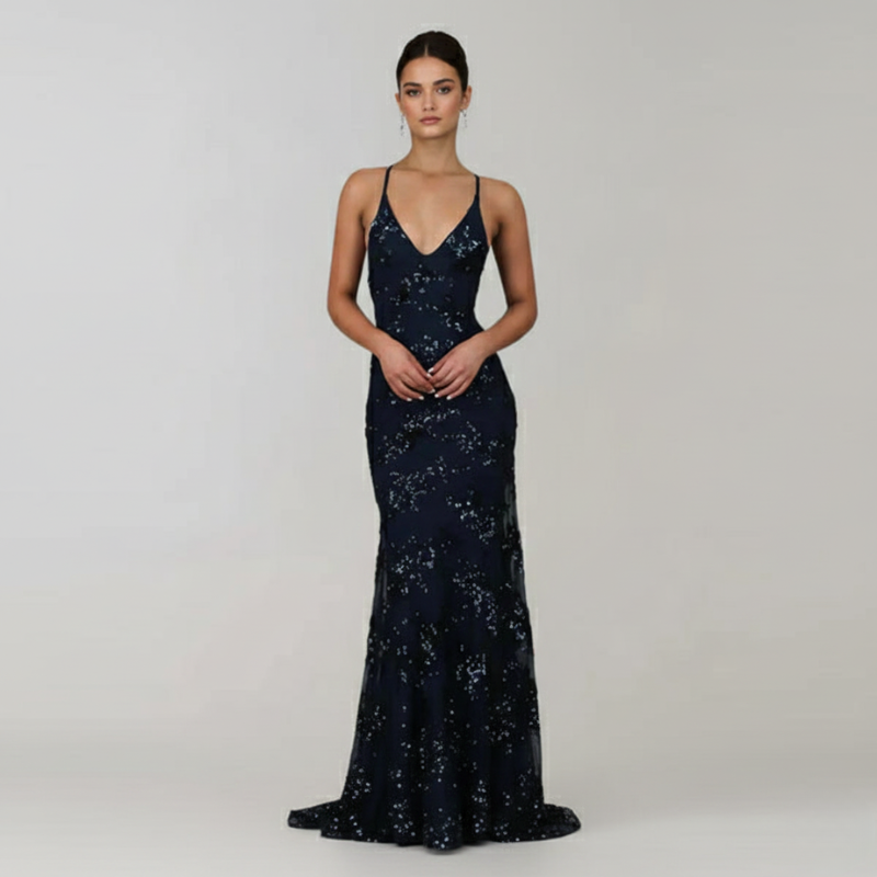 Navy blue sequin evening gown on a model against a plain background