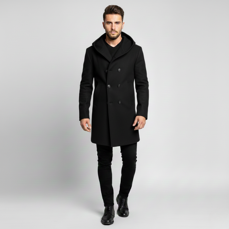 Man wearing a black coat on a gray background