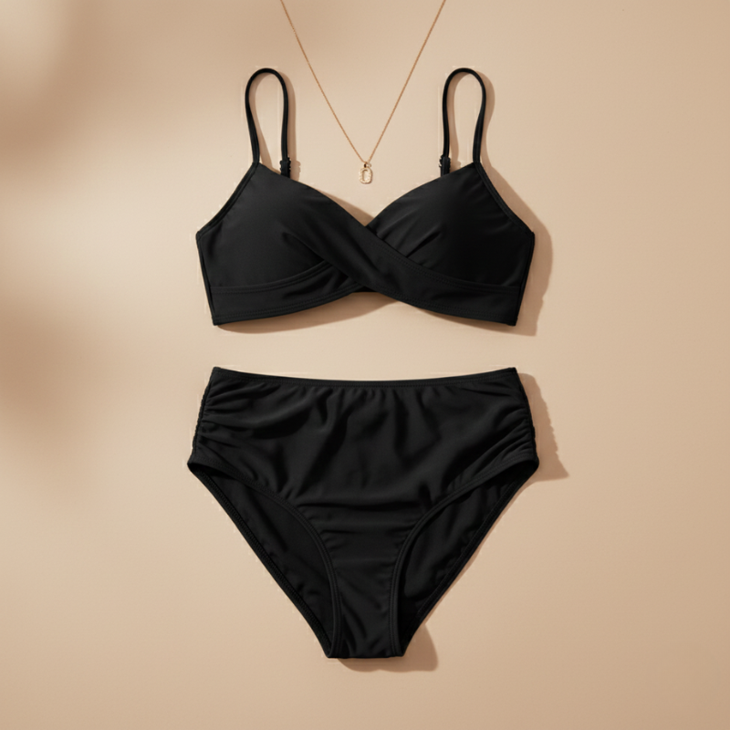 Black bikini set on a beige background