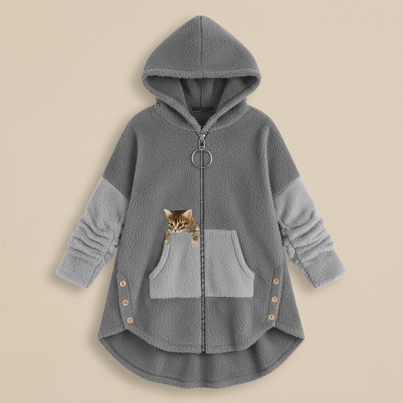 Gray hoodie with a pocket featuring a small cat plush toy  on a beige background