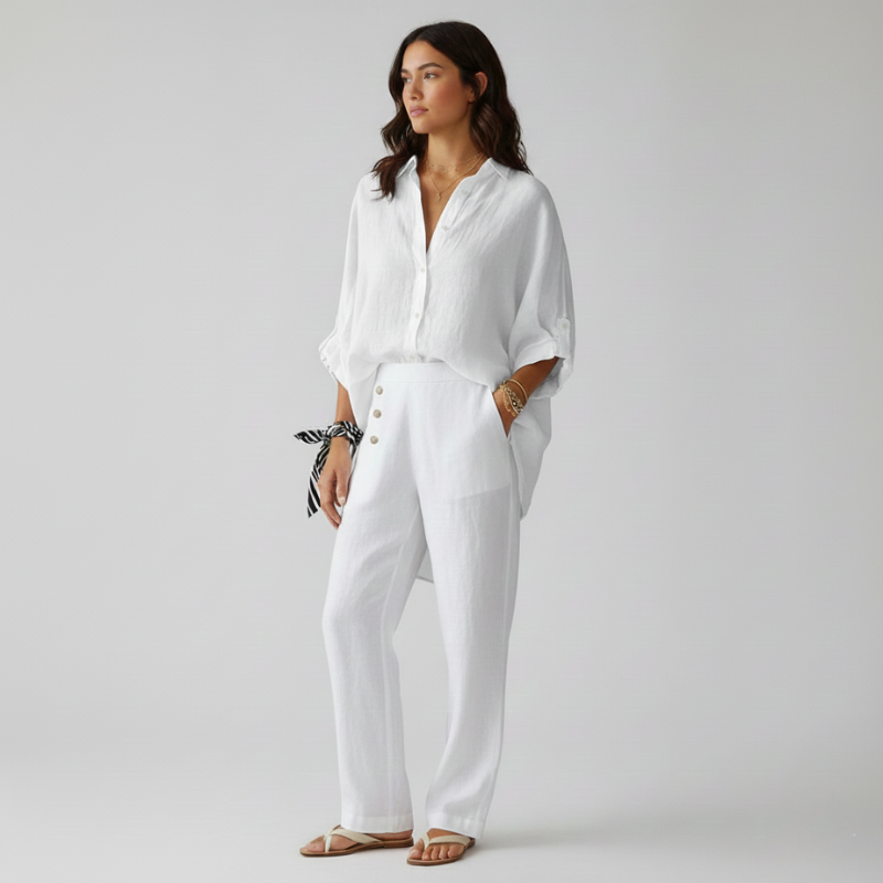 Woman wearing a white outfit on a plain background