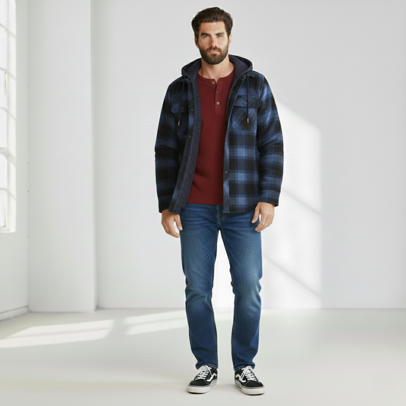 Male model standing in a blue check hooded jacket styled casually with jeans.