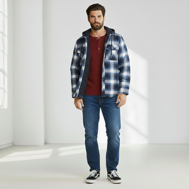 Man wearing a plaid hooded jacket with a relaxed fit in bright studio lighting.