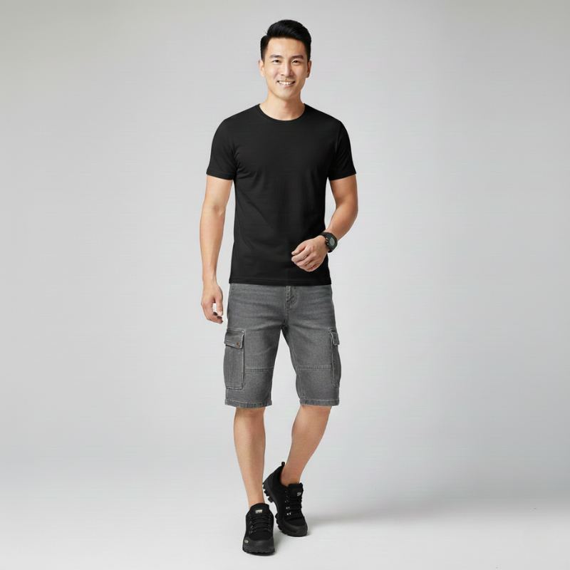 Man walking in olive hiking shoes paired with casual shorts and a fitted t-shirt.