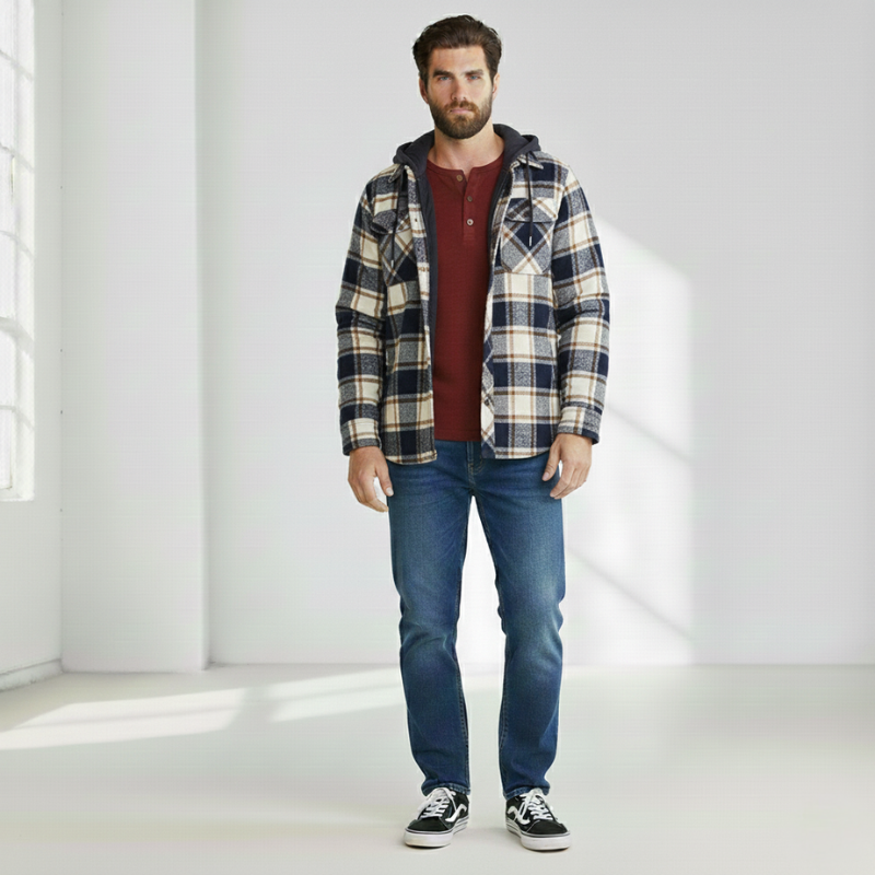 Flatlay of a blue plaid hooded jacket showing quilted lining and button-front design.