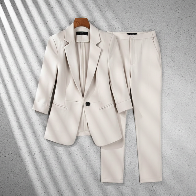 White suit jacket and pants on a gray background