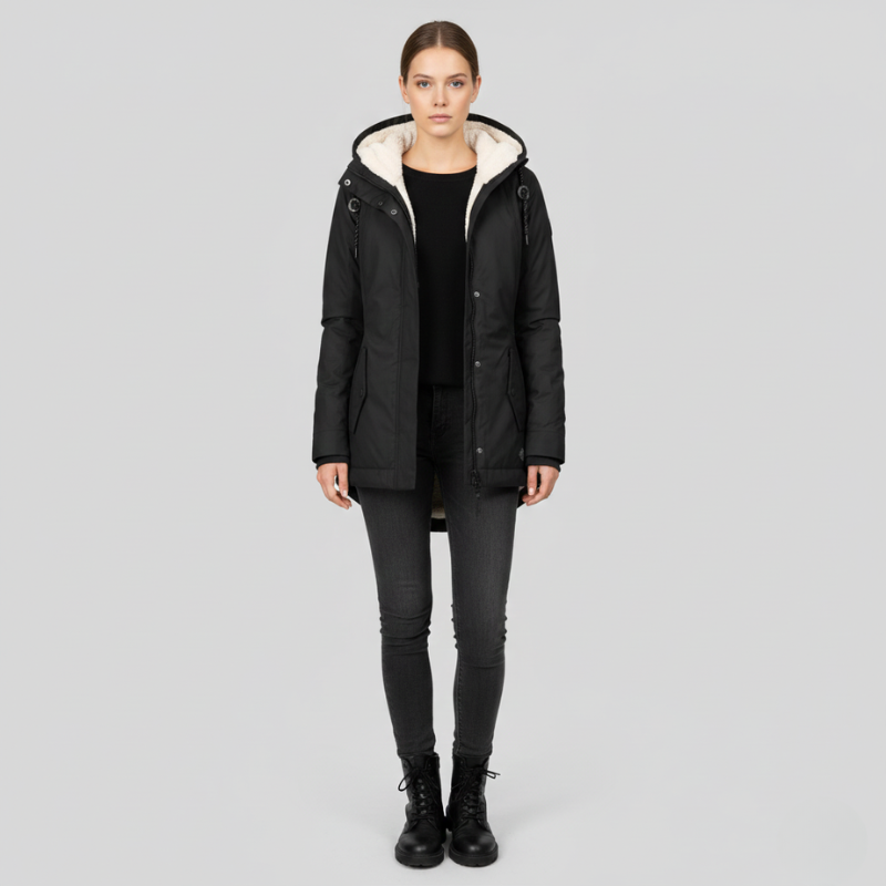 Person wearing a black coat with white lining on a gray background