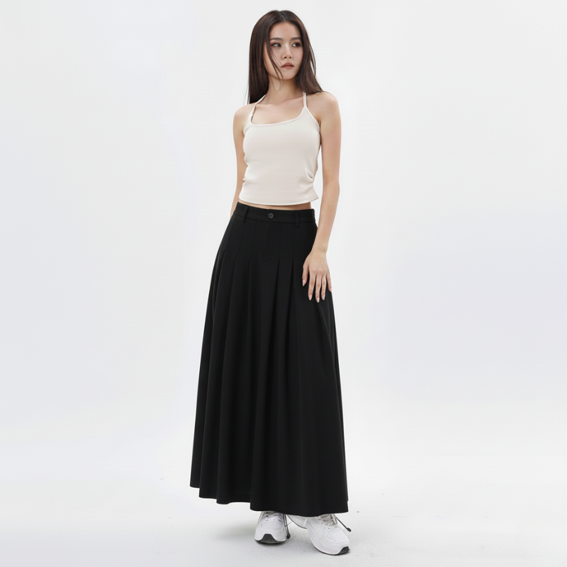 Woman wearing a white top and black long skirt on a white background