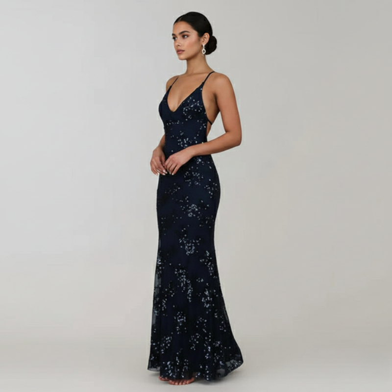 Navy blue sequin evening gown on a model against a plain background