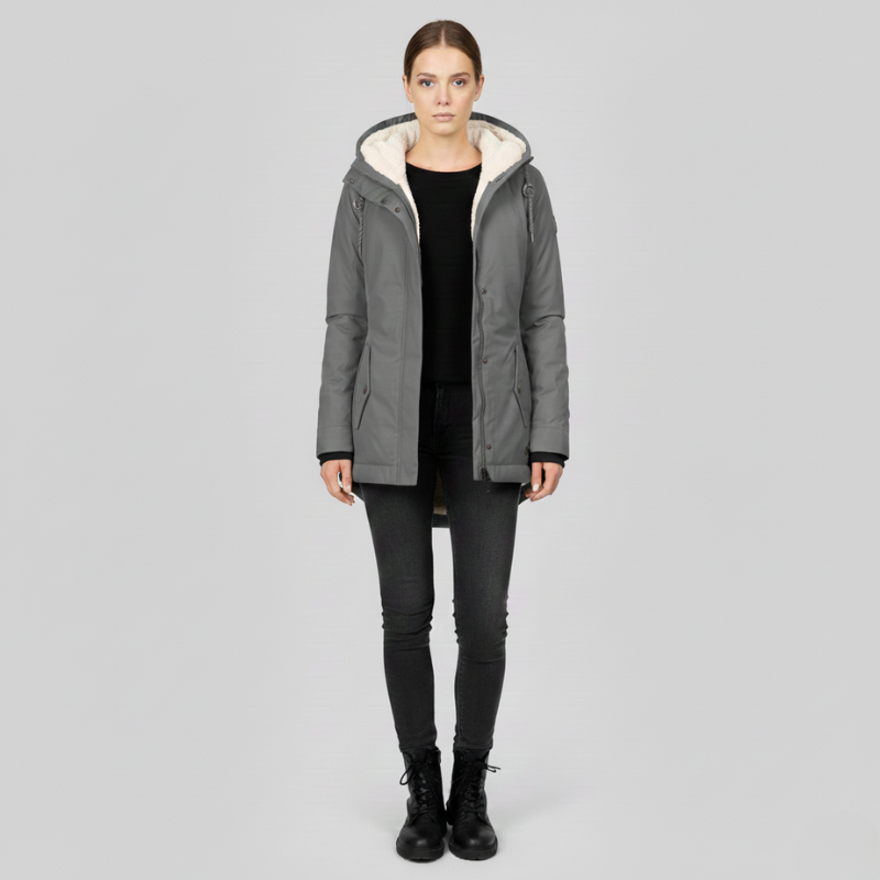 Woman wearing a gray parka with a white hood on a light gray background