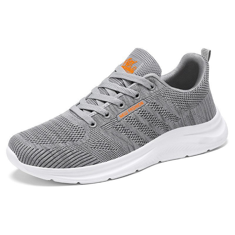 Gray running shoe with white sole on a white background
