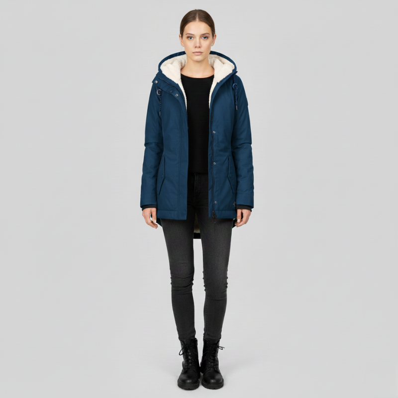 Person wearing a blue winter coat with white lining on a gray background