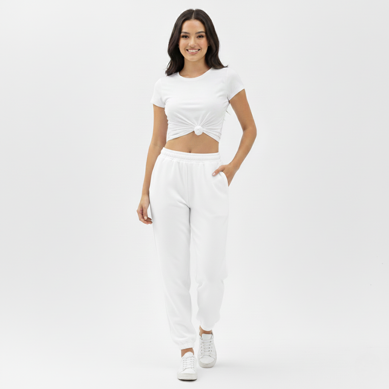 Woman wearing a white outfit on a plain background